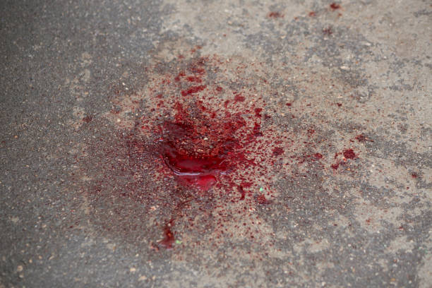 istock A stain of red blood on the pavement. 1434321014