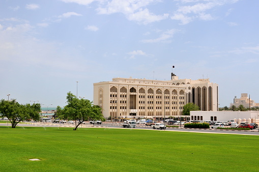 Doha, Qatar- May 5, 2010: Qatar is a fast-developing state in Middle East area and its capital Doha is a city full of wealth and dream. Here is the public green along the seaside avenue, Doha.