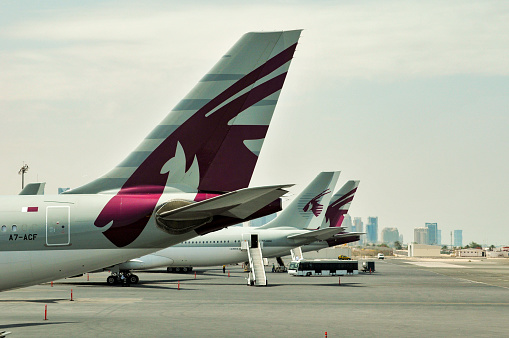 Doha, Qatar- May 5, 2010: Qatar is a fast-developing state in Middle East area and its capital Doha is a city full of wealth and dream.  Here is airfleet of Qatar Airways in Doha International Airport.