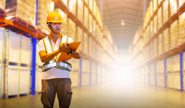 istock Workers Holding Clipboard is Checking Cargo Palltes Boxes on Tall Shelf. Storage Suppliers Warehouse. Inventory Management. Supply Chain. Shipment Goods. Shipping Warehouse Logistics. 1434324388