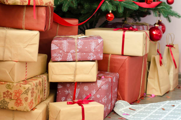 istock Christmas gifts on the floor under the tree 1434326220