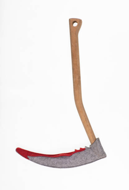 istock halloween scythe toy isolated on white background 1434326287