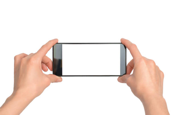 istock Smartphone with blank white screen in female hands. Female hands are holding a phone, isolate. 1434326355