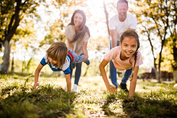 istock Family's wheelbarrow race in nature! 1434332005