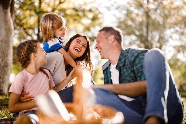 istock Cheerful family talking on a picnic in spring day. 1434332189