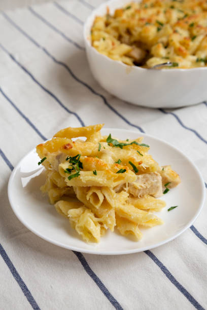 istock Homemade Chicken Alfredo Pasta Bake with Parsley, side view. 1434333433