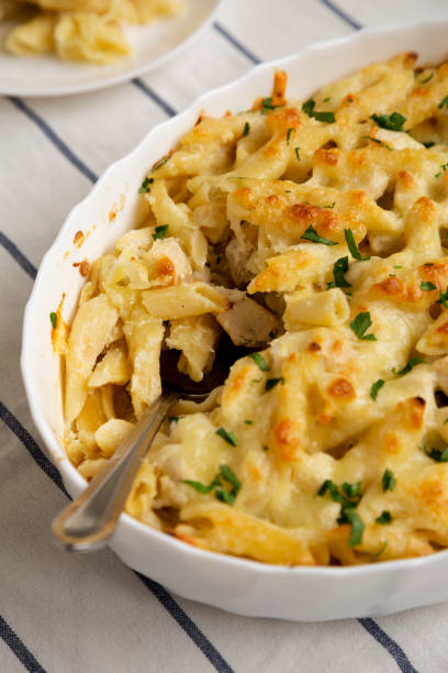 istock Homemade Chicken Alfredo Pasta Bake with Parsley, side view. Close-up. 1434333551