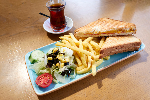 Toasted Sandwich With French Fries,Salad And Tea