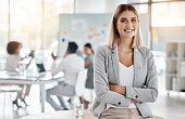 Portrait of girl leader or manager at a team planning, collaboration and strategy business meeting. Woman empowerment, leadership and management at a marketing office of a startup corporate company