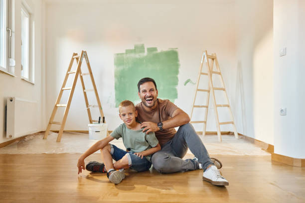 istock Happy single father and son enjoying during home renovation process. 1434334256