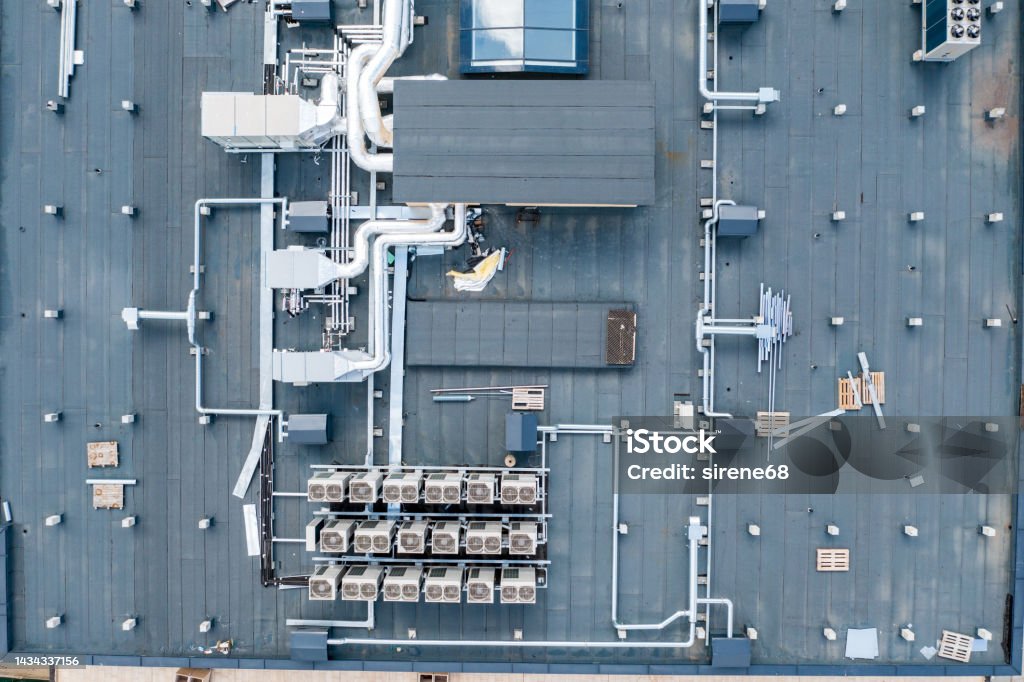 air ventilation air ventilation flow system on the roof of the building. vent pipe fan HVAC. Factory Stock Photo