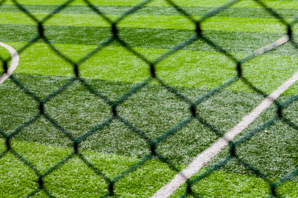 football training ground without people - soccer soccer field artificial turf man made material imagens e fotografias de stock