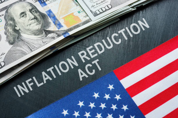 USA flag, dollars and inscription inflation reduction act. stock photo