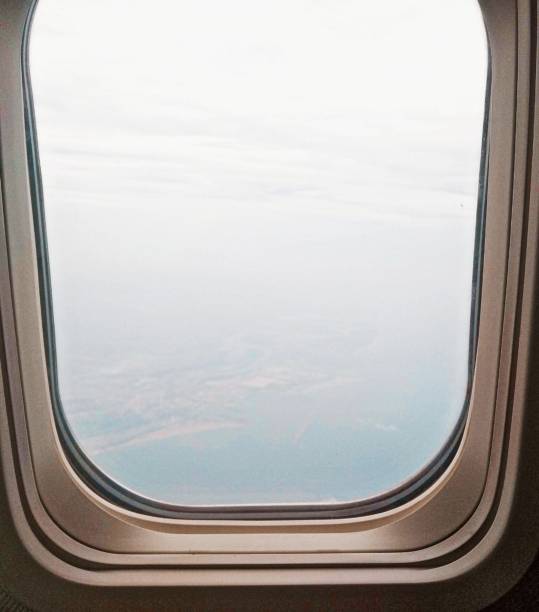 istock Airplane Window Close-up .View of clouds from Airplane Window. 1434339452