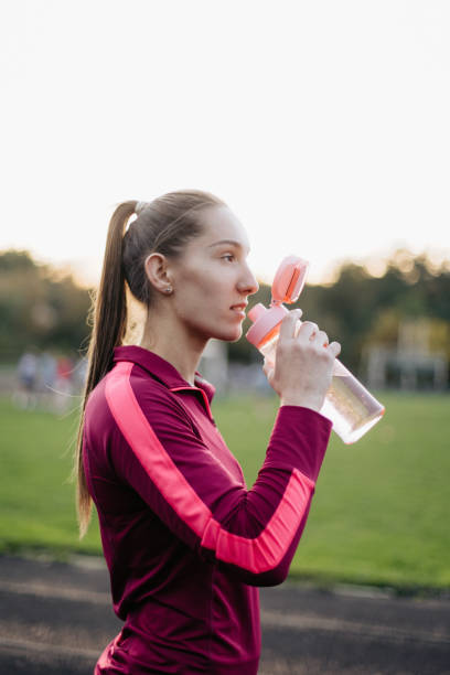 istock A woman drinking water after sport activity 1434342303