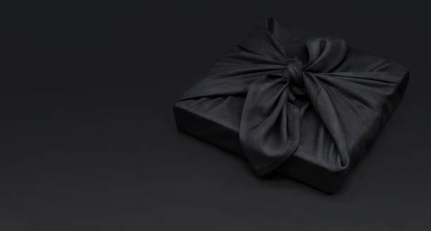 istock Black friday gift box wrapped in fabric with copy space. Traditional Japanese gift wrapping furoshiki style. Eco friendly holiday concept. 1434346277