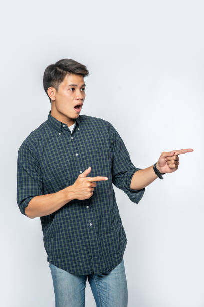 istock The man in the black shirt pointed to the left. 1434346449