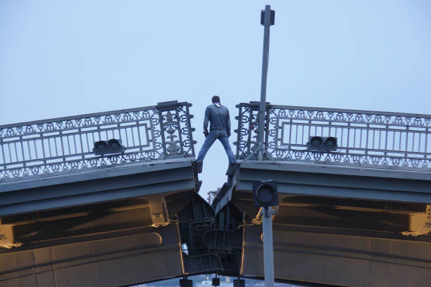 Saint Petersburg-Russia - 16.06.2022:  A man stands on the divorced Blagoveshchensk Bridge.