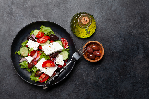 Greek salad with fresh vegetables and feta cheese. Flat lay with copy space