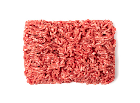 Minced beef meat isolated. Ground fresh buffalo meat fillet, uncooked red mincemeat, raw veal forcemeat, farce minced meat portion on white background top view