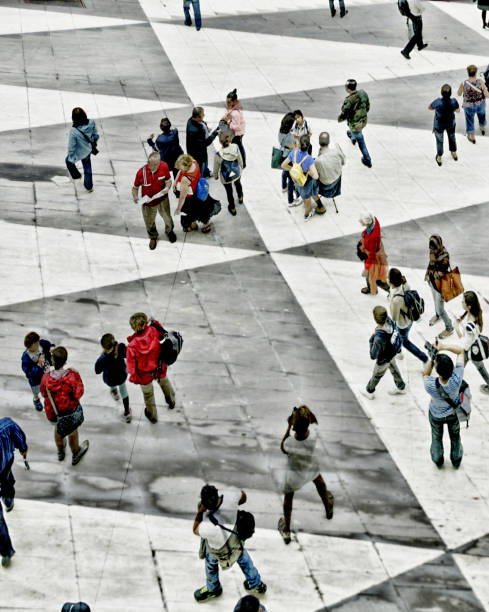 Abstract image of people walking on a town square. Shot of unrecognizable people walking on town square Sergels Torg. The city is Stockholm, Sweden. stockholm town square sergels torg sweden stock pictures, royalty-free photos & images