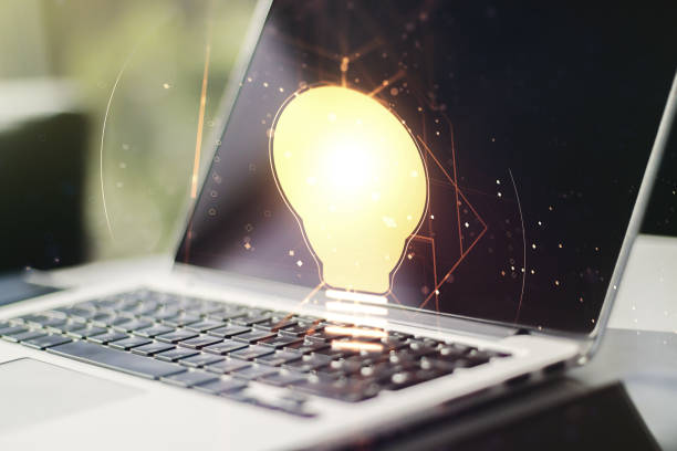 istock Creative idea concept with light bulb illustration on modern laptop background. Multiexposure 1434354750
