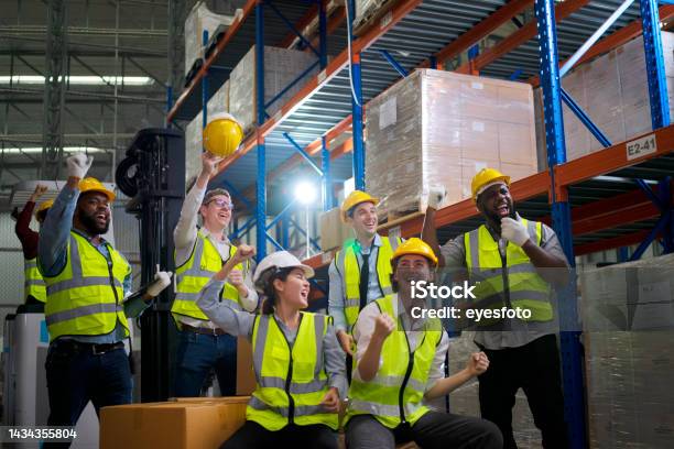 Blue Collar Workers Are Working At Warehouse Stock Photo - Download Image Now - Dancing, Warehouse, Working