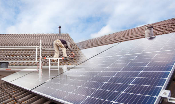 istock Roofer, worker on the rooftop. Roofing work. Solar Cell Installation. Preparation of Solar panel installation. attaching rails. scaffolding on construction site 1434356392