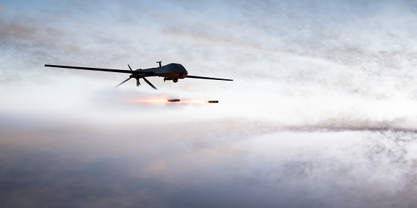 Avión no tripulado de combate militar UAV lanzando misiles photo
