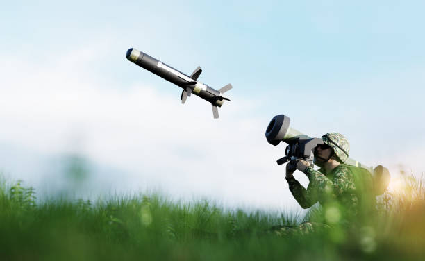 Soldier firing anti-tank missile at war Soldier firing anti-tank missile at war from his lightweight portable weapon system javelin stock pictures, royalty-free photos & images