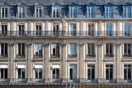 Residential building view in Berlin. Facade of a big apartment building with small balconies.