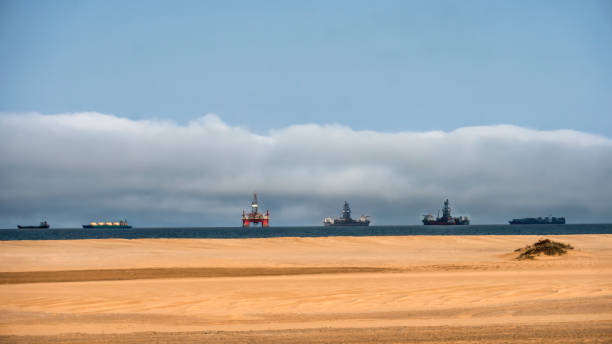 few oilrigs and ships at large in the ocean