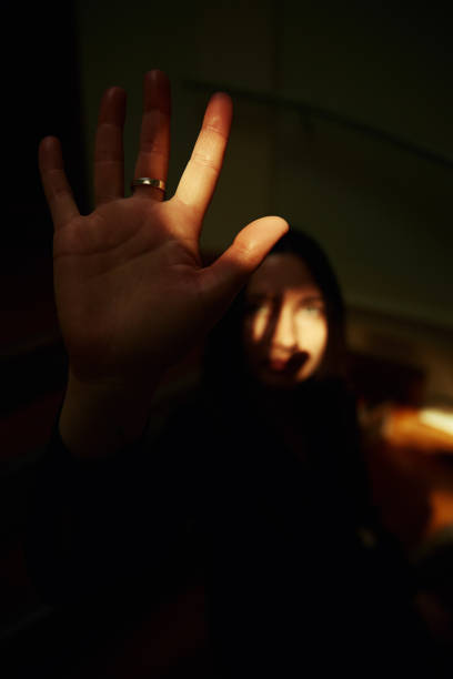 istock Creative woman portrait with sun rays in dark room. 1434362134