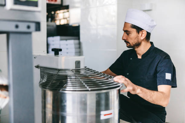 istock Italian chef pizzaiolo preparing pizza dough in restaurant kitchen 1434363343