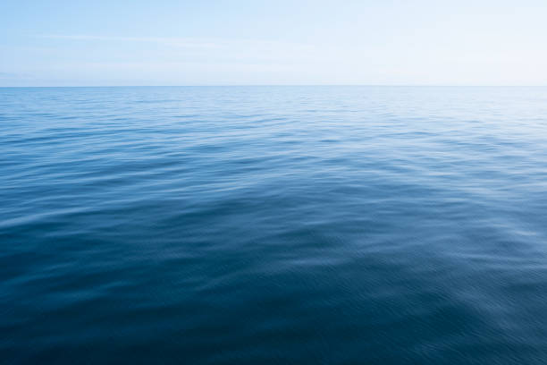 beautiful blue water surface, background material - deniz seviyesi stok fotoğraflar ve resimler