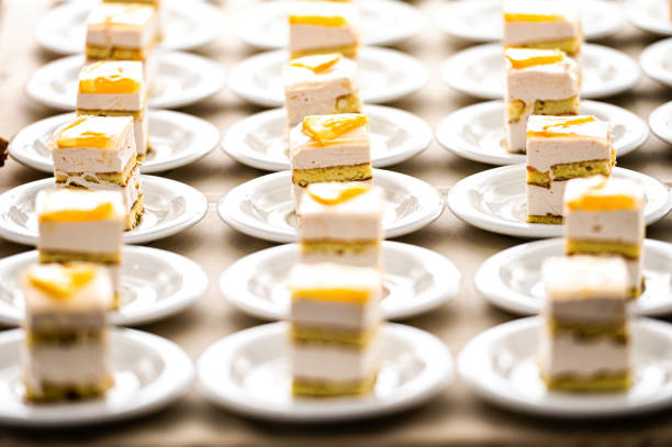 abstract background of many rows of cake dessert plates, selective focus