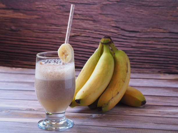 istock Banana milk for breakfast on a wooden background 1434367995