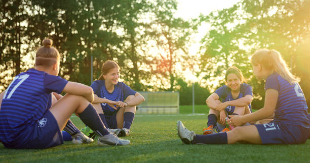 istock Football players resting after match 1434372349