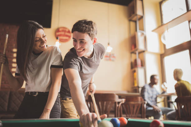 istock Couple playing pool in the pub 1434377585