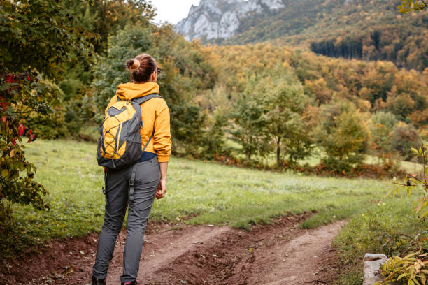 istock Woman enjoying autumn walk in mountains alone 1434378454