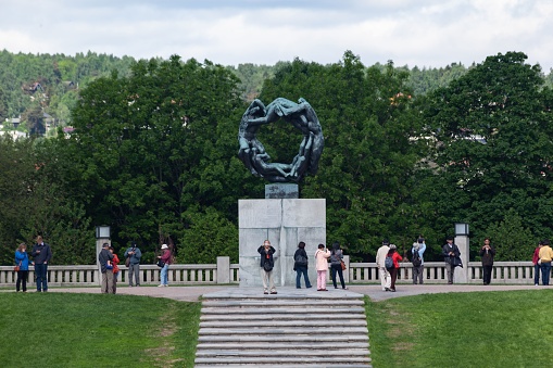 Oslo, Norway – June 06, 2013: The beautiful sculpture in the Vigeland park with tourists, Oslo