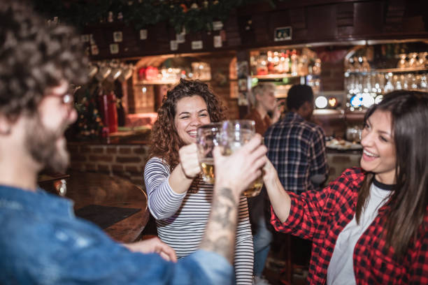 istock Friends cheering in a pub. They are drinking beer 1434380202