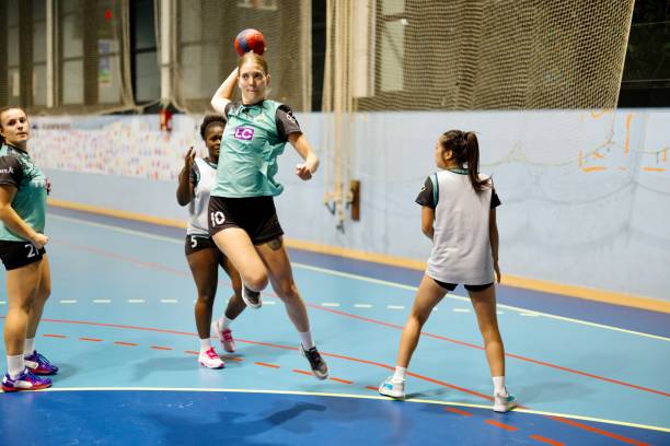 istock Women handball player shooting at goal 1434381472
