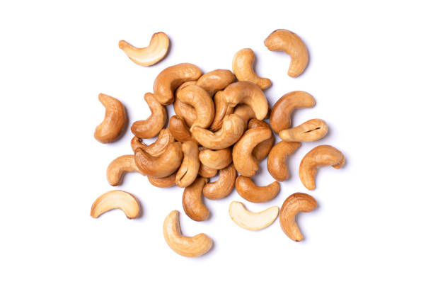 roasted cashew nut Group of roasted cashew nut isolated on white background. Top view. Flat lay. cashew stock pictures, royalty-free photos & images