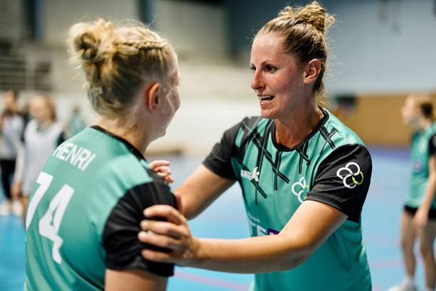 istock An older handball player encourages a younger teammate 1434384130
