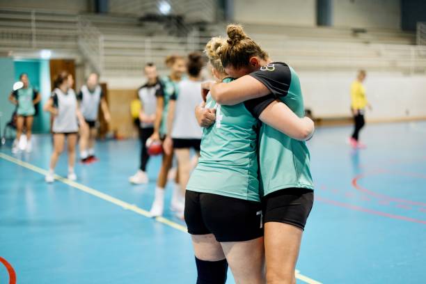 istock An older handball player encourages a younger teammate 1434384134