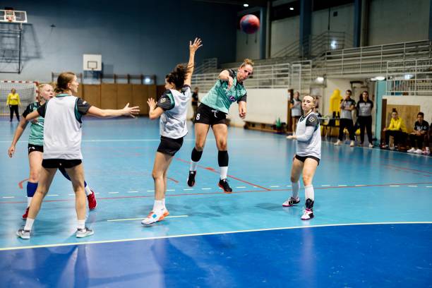 istock Female players perform an attacking practice during handball training 1434384163