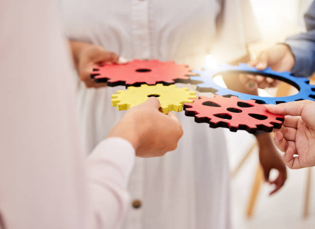 istock Success, collaboration and teamwork, people hands with gears. Diversity, hands and a team of business people working together. Planning, strategy and cooperation with men and women in the work office 1434385356