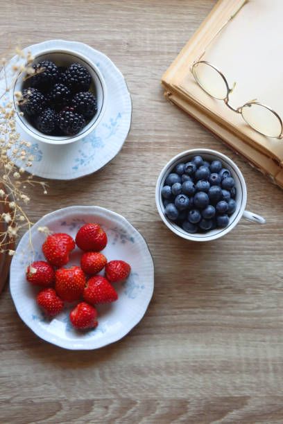 istock Various Berries, Book and Flowers 1434386546