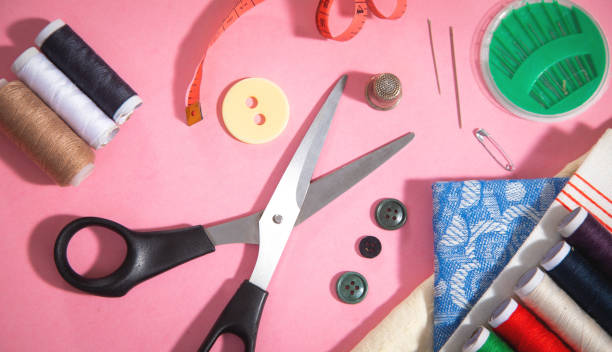 istock Sewing tools on the pink paper background. 1434387547
